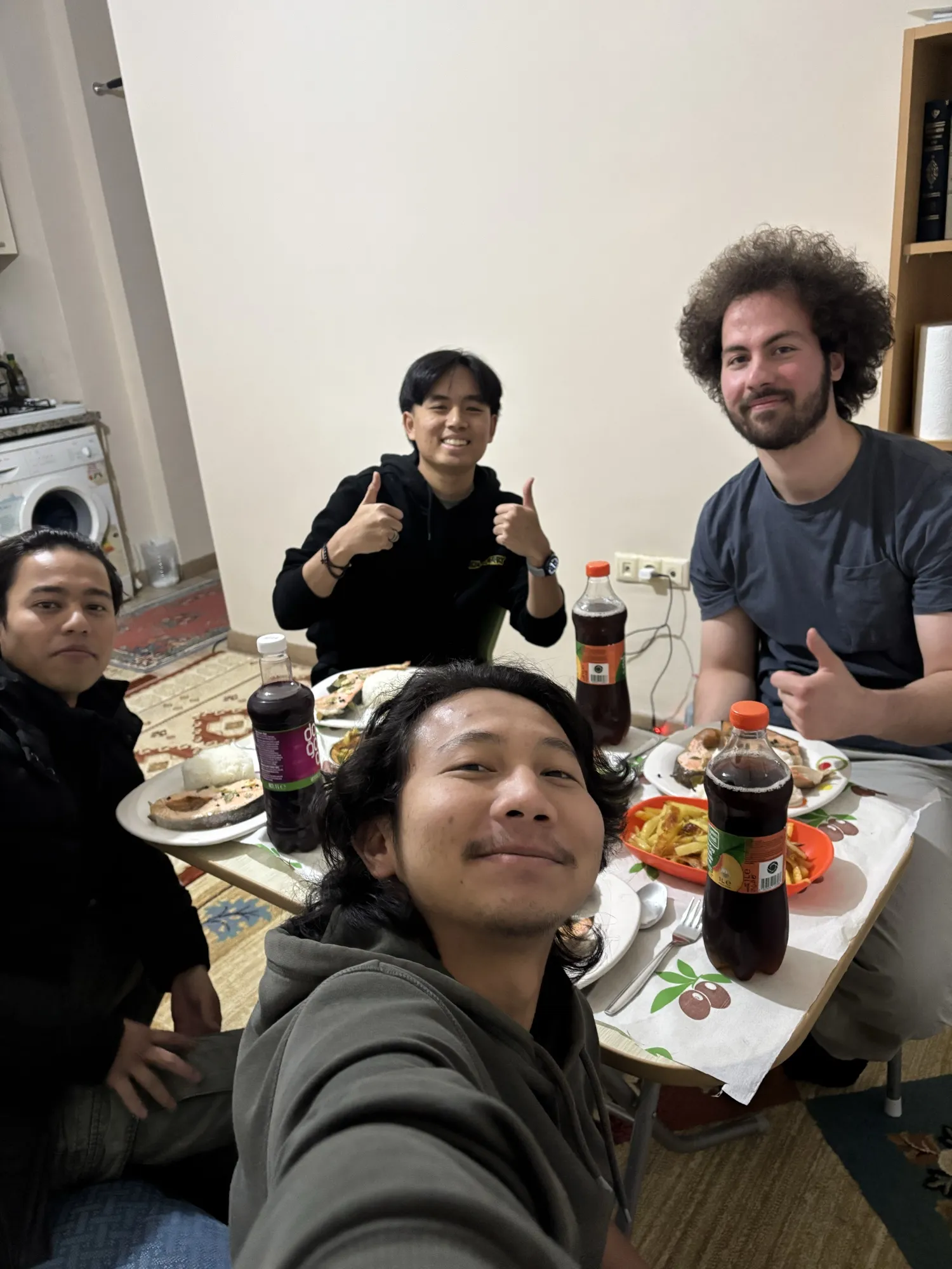 A selfie with friends around a dinner table
